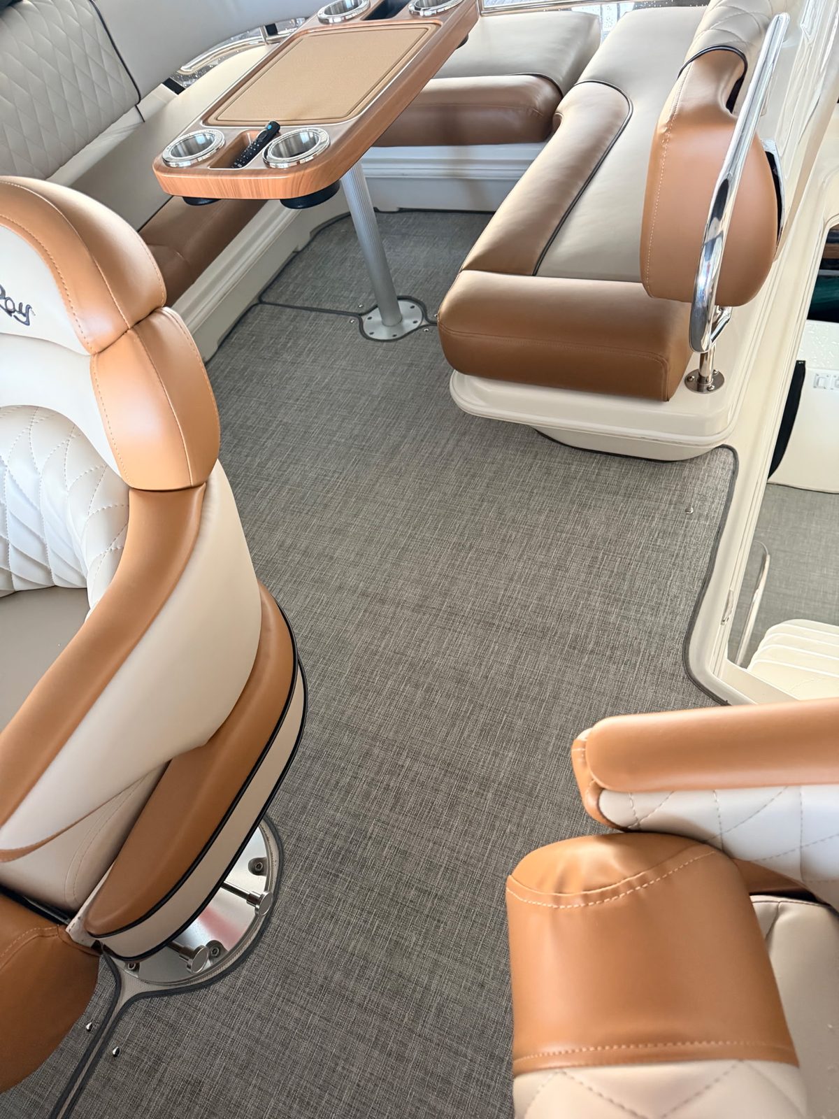 Woven vinyl flooring in a boat's cockpit seating area